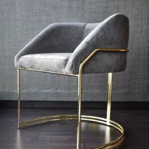 نيرو كرسي مودرن رمادي بإطار ذهبي من ليفينج